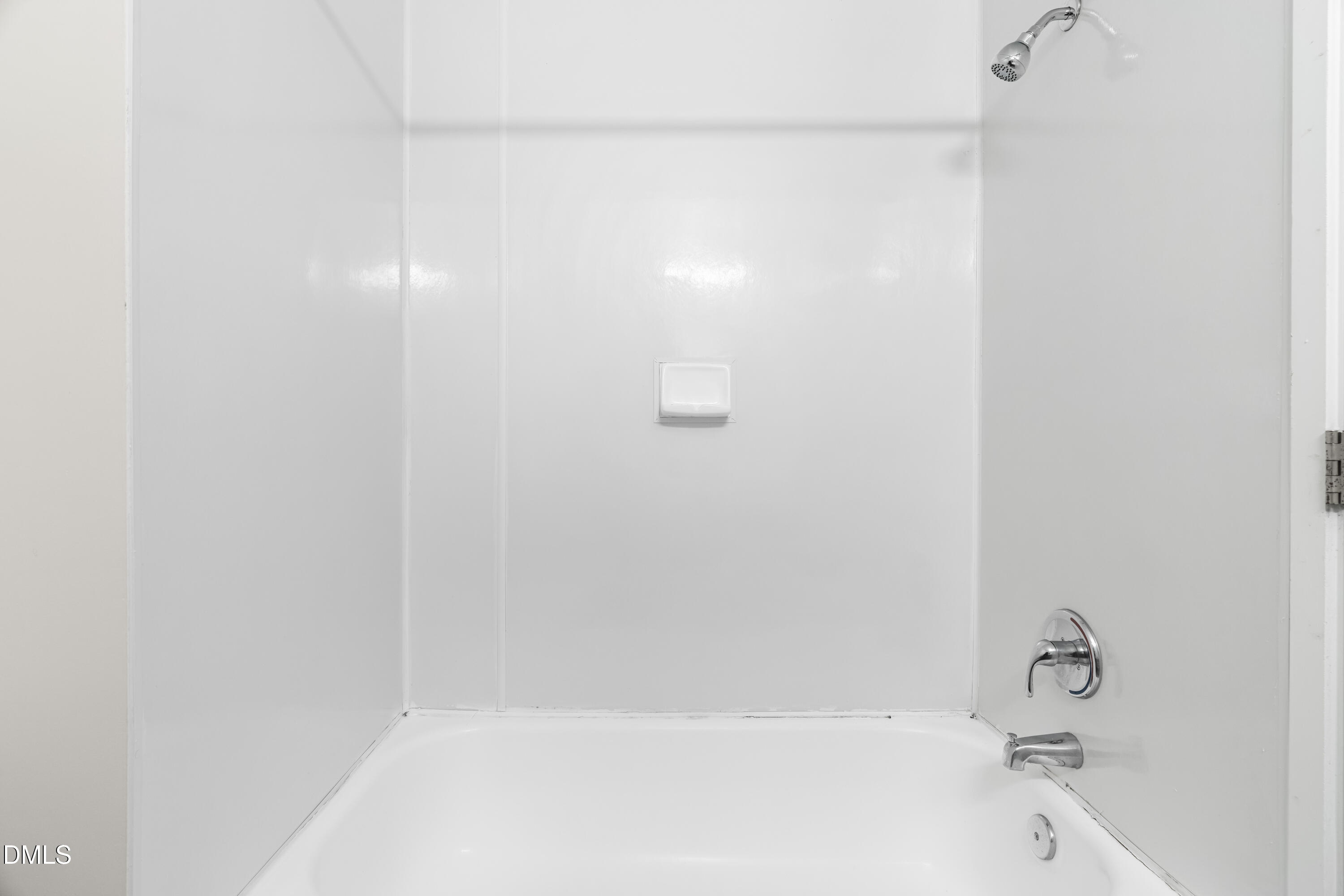 5104 Hollyridge Drive, Unit 303 Raleigh, NC 27612 - Photo 10 of 21 a bathroom with a bathtub