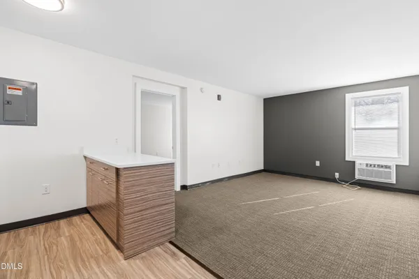 a view of an empty room with a window