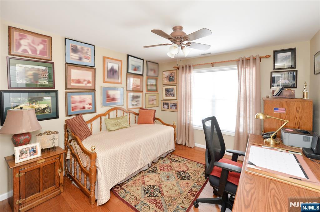 40 Chanda Court, Unit D040 Clifton, NJ 07012 - Photo 13 of 17 a bedroom with furniture and a window