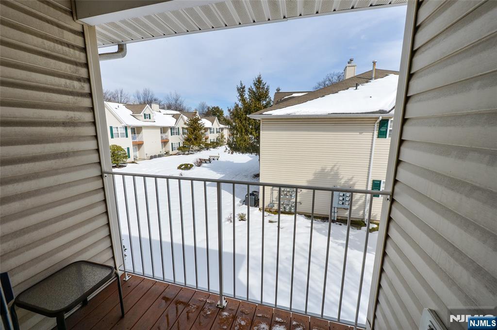 40 Chanda Court, Unit D040 Clifton, NJ 07012 - Photo 15 of 17 a view of a balcony with wooden floor