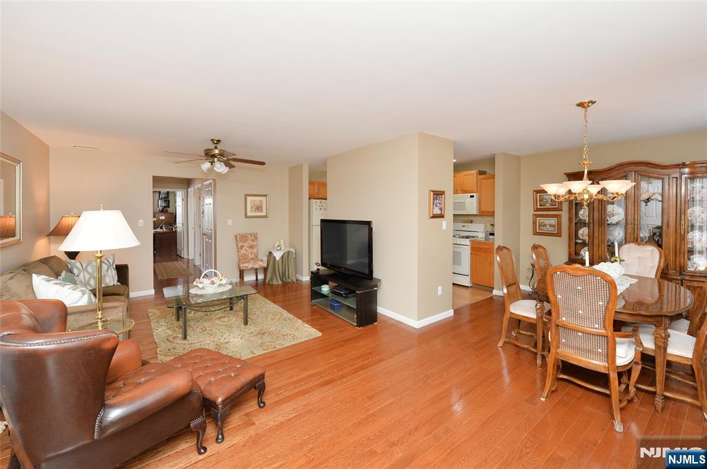 40 Chanda Court, Unit D040 Clifton, NJ 07012 - Photo 4 of 17 a living room with furniture and a flat screen tv