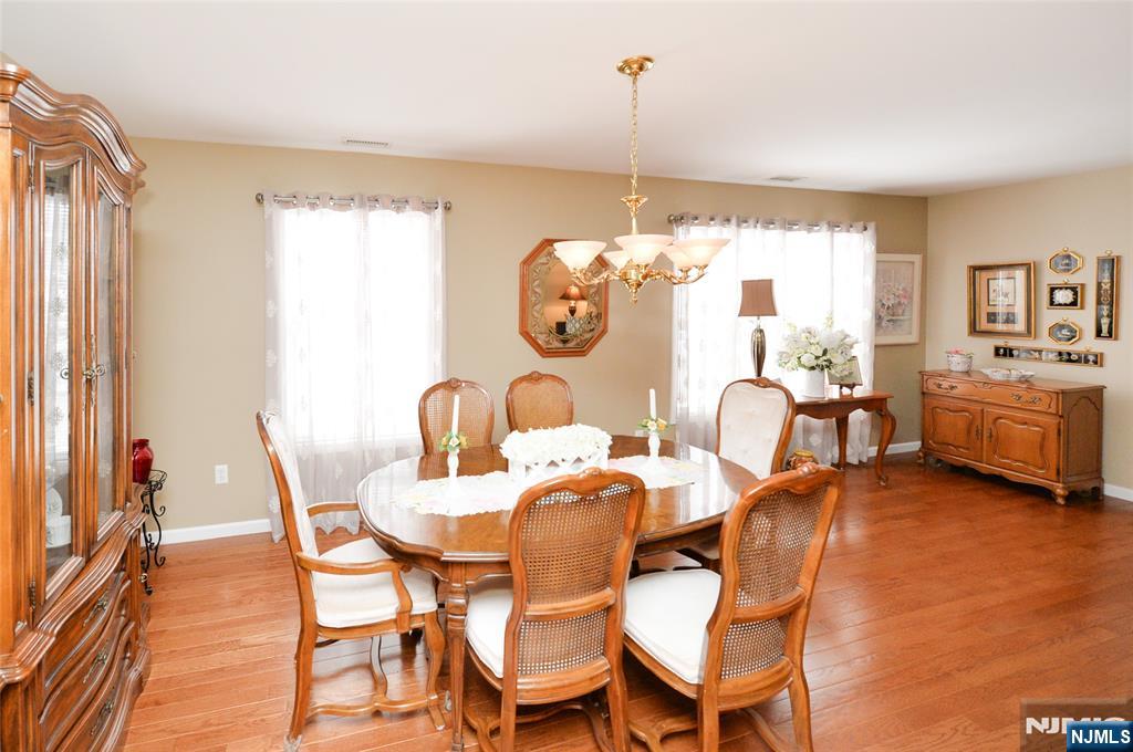 40 Chanda Court, Unit D040 Clifton, NJ 07012 - Photo 8 of 17 a dining room with furniture and window