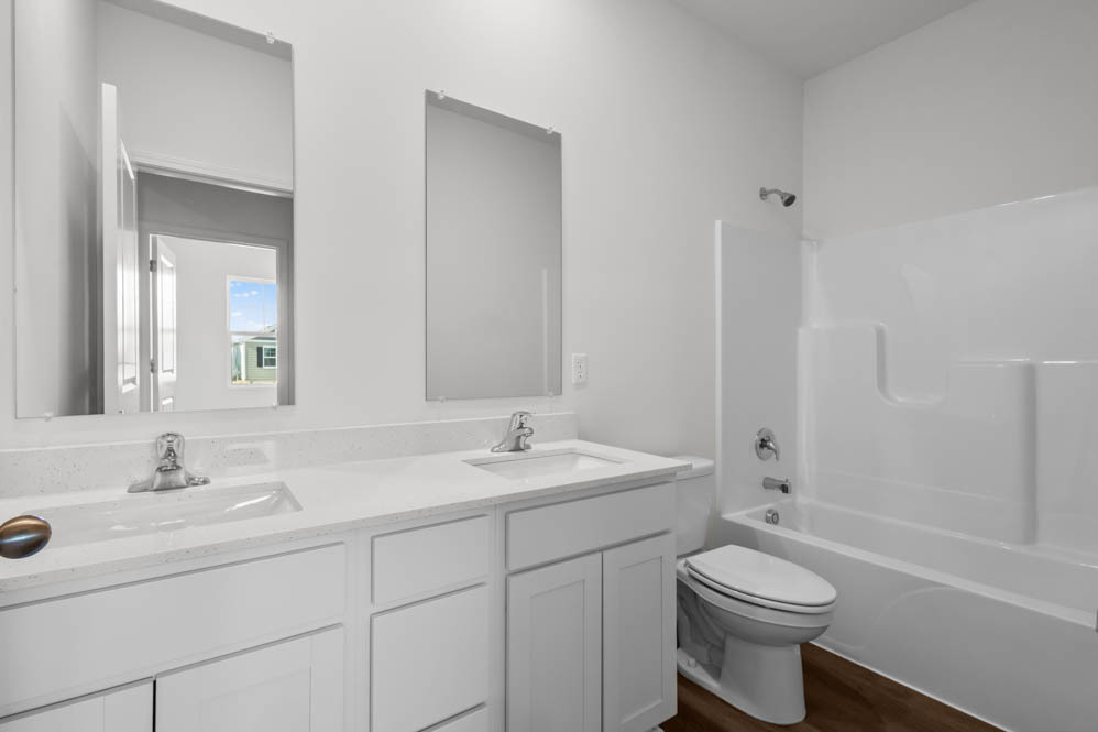 315 Snowdrop Lane Elgin, IL 60124 - Photo 19 of 46 a bathroom with a sink toilet a mirror and shower