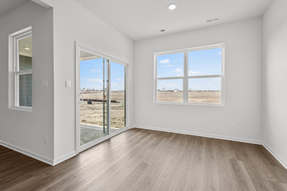 315 Snowdrop Lane Elgin, IL 60124 - Photo 35 of 46 an empty room with wooden floor and windows