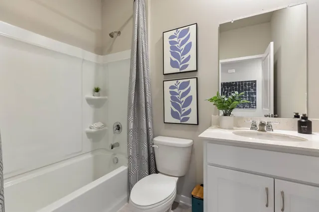 a bathroom with a toilet a sink and a bathtub
