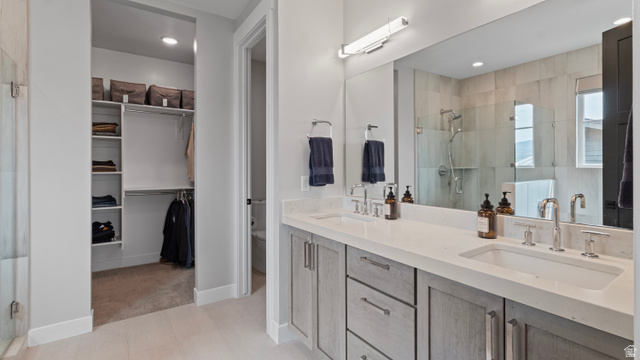 355 East Overlook Loop Hideout, UT 84036 - Photo 18 of 40 Primary suite's double vanity with integrated sinks and chrome fixtures