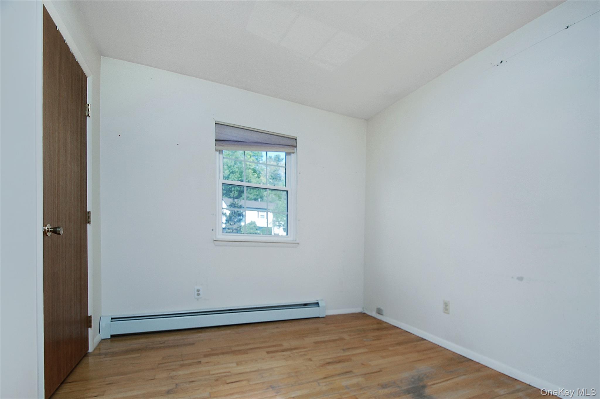 554 High Street Monroe, NY 10950 - Photo 22 of 29 an empty room with wooden floor and windows