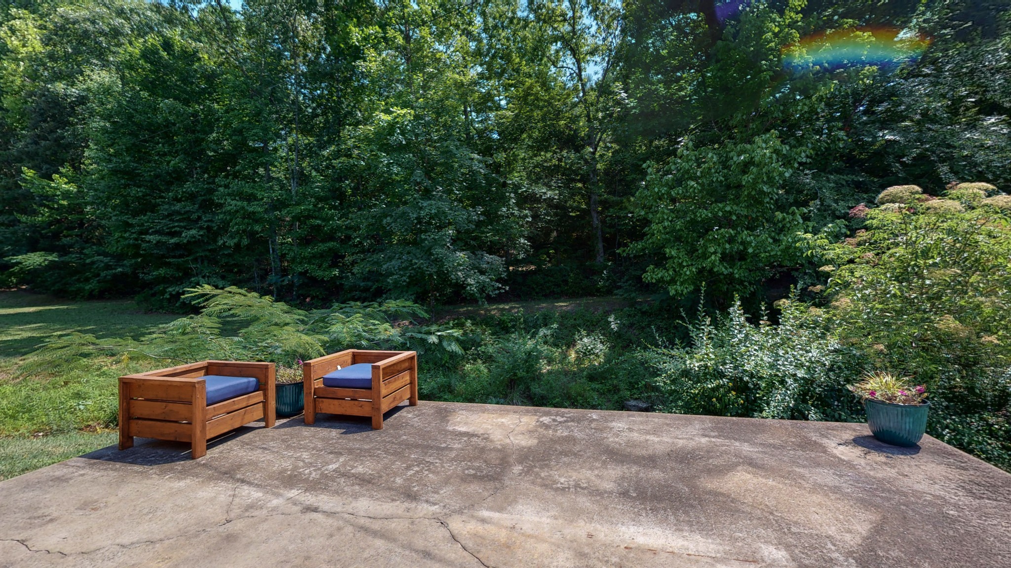 7401 Liberty Road Fairview, TN 37062 - Photo 6 of 55 a wooden bench sitting in the middle of a garden