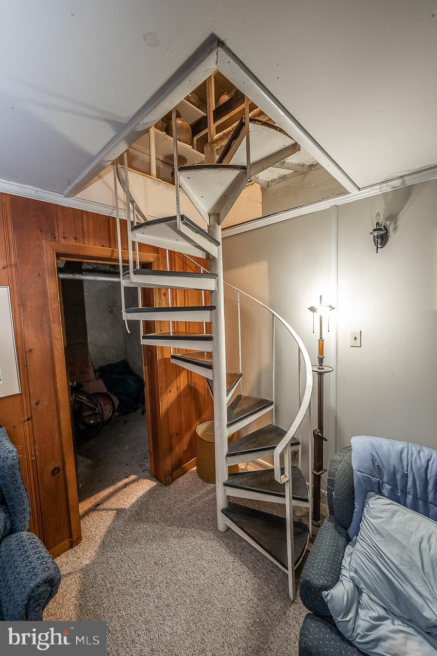 338 Sugartown Road Devon, PA 19333 - Photo 20 of 50 Spiral stairs from lower level to living room