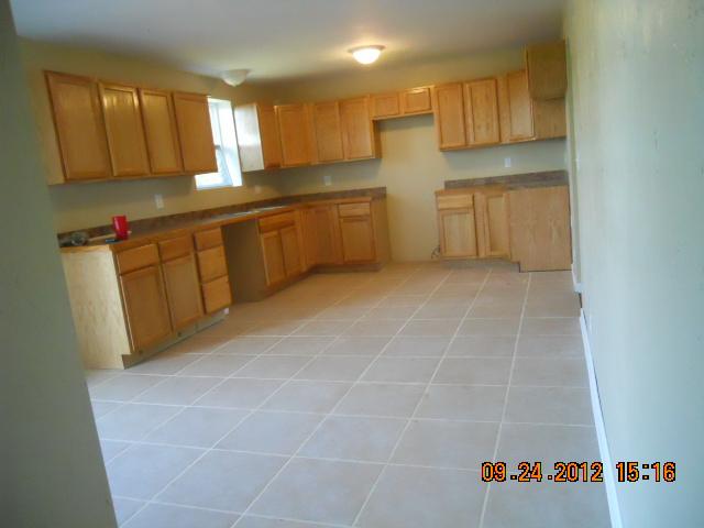 10784 Spence Road Bon Aqua, TN 37025 - Photo 11 of 20 PLENTY OF SPACE FOR TABLE BUT MANY PRETTY KITCHEN CABINETS