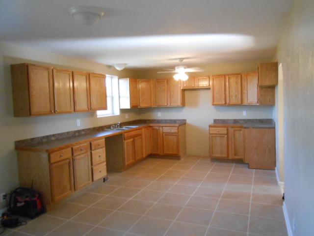 10784 Spence Road Bon Aqua, TN 37025 - Photo 14 of 20 KITCHEN HAS MANY NEW CABINETS GREAT FOR COOKING. PLENTY OF ROOM FOR TABLE. TILE ON FLOORS