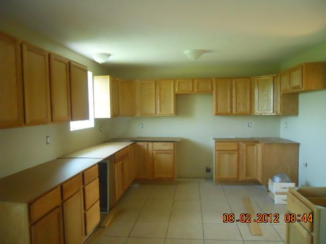 10784 Spence Road Bon Aqua, TN 37025 - Photo 4 of 20 MANY NEW KITCHEN CABINETS AND NEW TITLE FLOOR. SPACE FOR DINING TABLE
