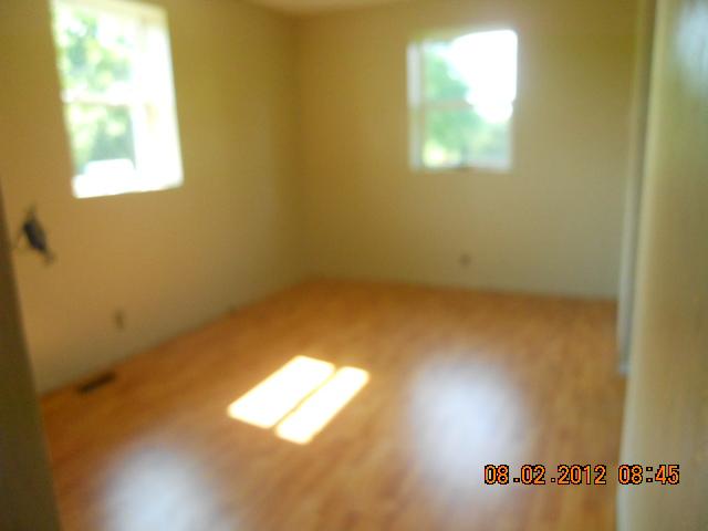 10784 Spence Road Bon Aqua, TN 37025 - Photo 5 of 20 FRONT BEDROOM HAS NEW LAMINATE FLOORS