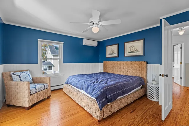 a spacious bedroom with a bed and a couch