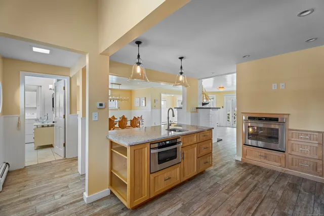 a kitchen with stainless steel appliances a stove and a refrigerator