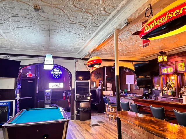 a view of a cafe with sitting area