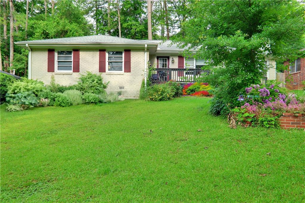 1591 Stanford Way Decatur, GA 30032 - Photo 1 of 1 a front view of a house with garden