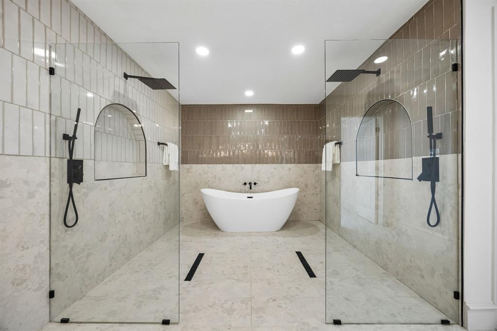 1260 Stacy Road Fairview, TX 75069 - Photo 19 of 40 Open concept double shower with waterfall heads, body sprayers, frameless glass, and an elegant soak tub