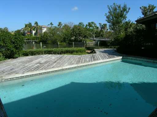 19 Simara Street Stuart, FL 34996 - Photo 6 of 8 a view of yard with swimming pool and green space