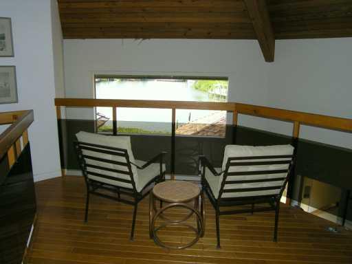 19 Simara Street Stuart, FL 34996 - Photo 8 of 8 a outdoor space with a lounge chair