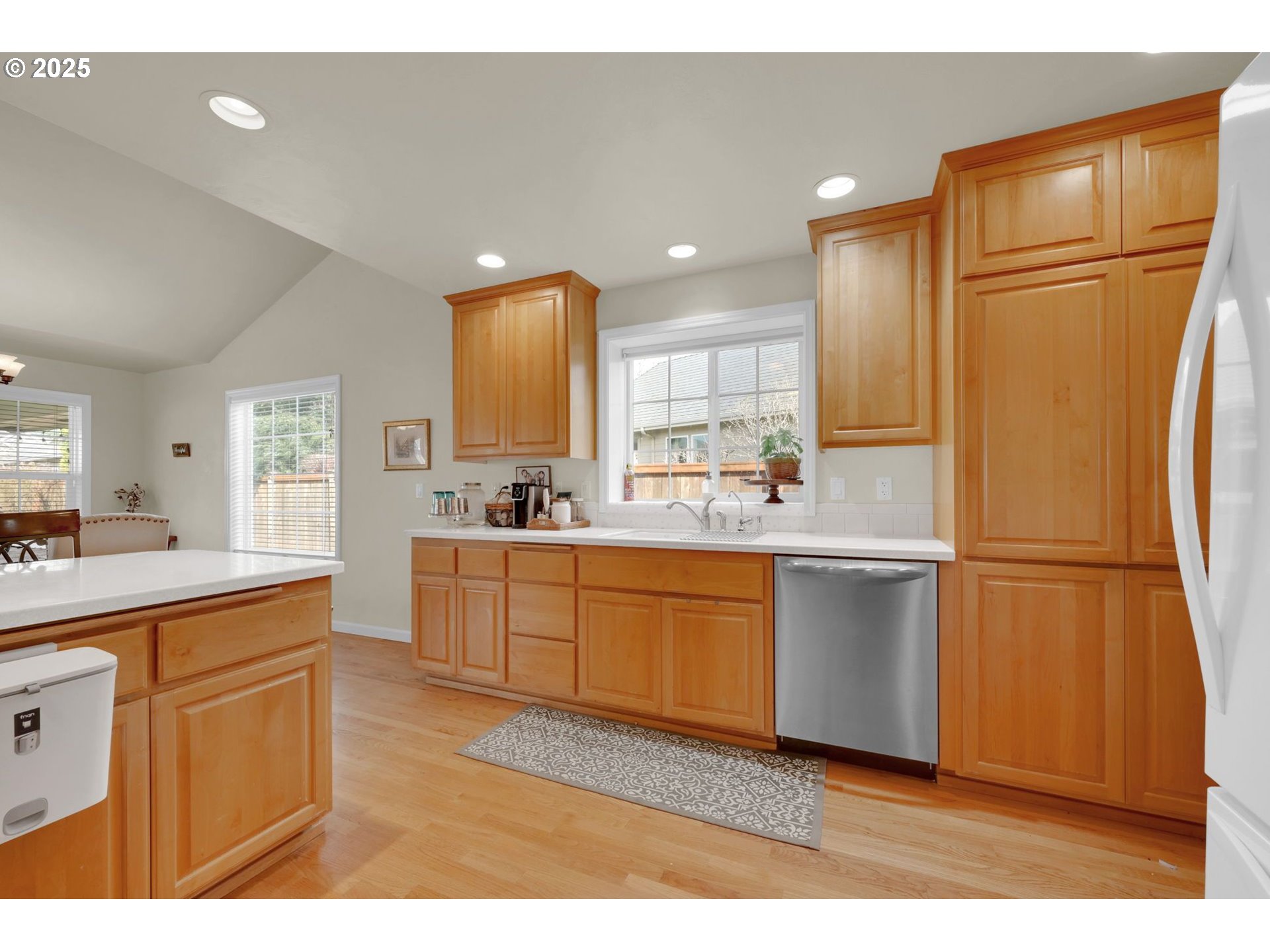 832 Mint Meadow Way Springfield, OR 97477 - Photo 12 of 31 a kitchen with white cabinets and refrigerator