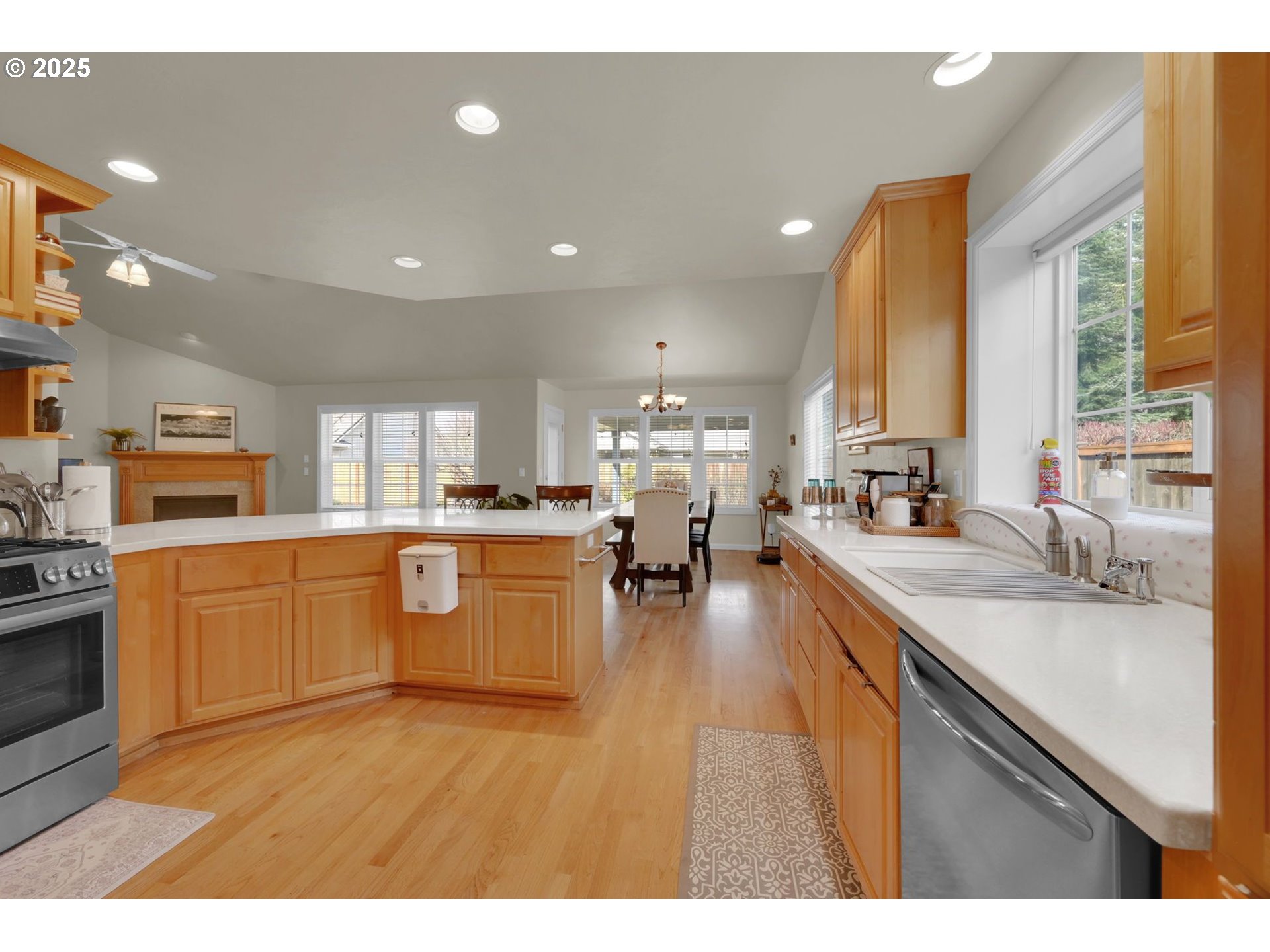 832 Mint Meadow Way Springfield, OR 97477 - Photo 13 of 31 a large kitchen with stainless steel appliances lots of counter space and a sink
