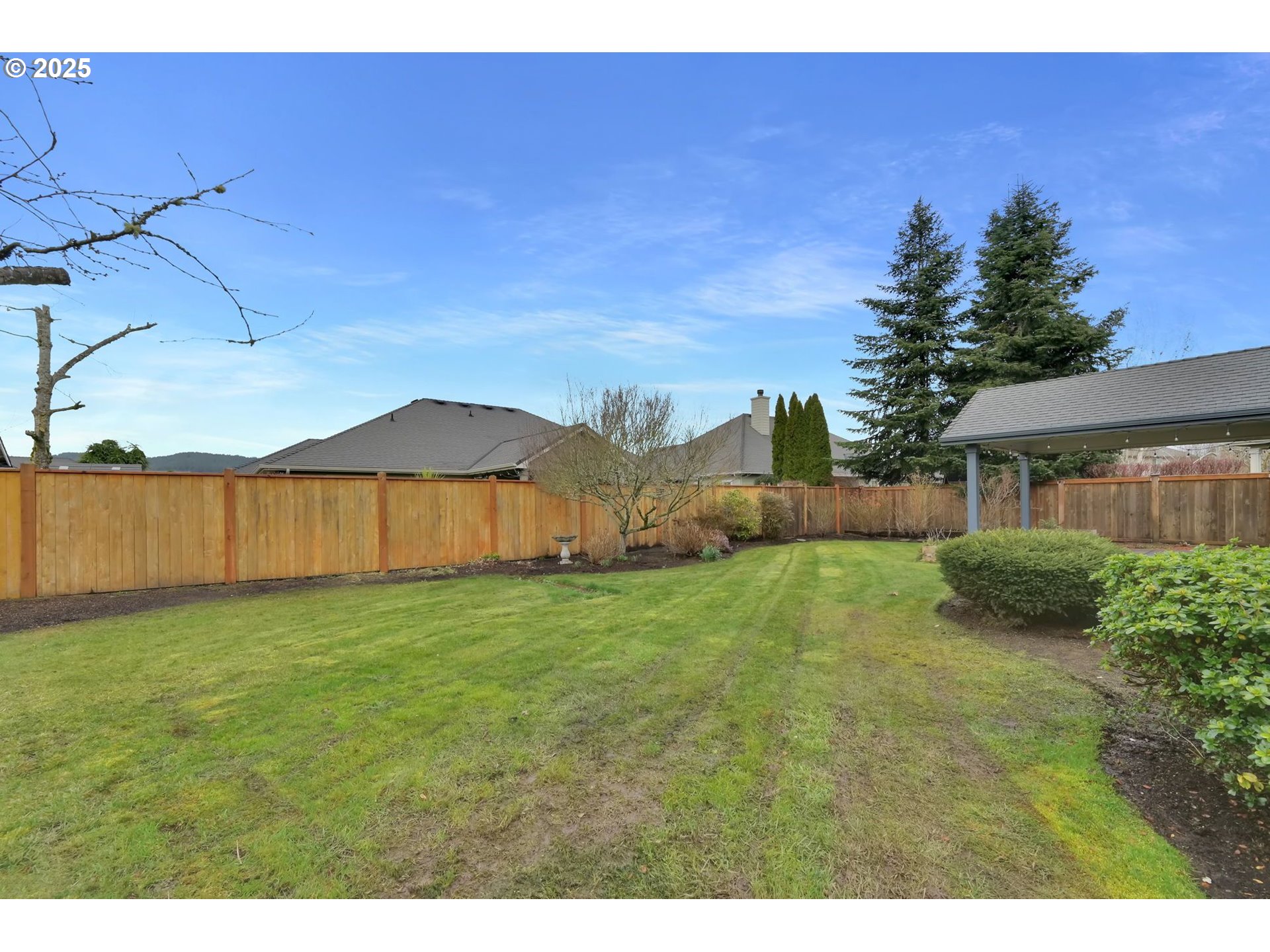 832 Mint Meadow Way Springfield, OR 97477 - Photo 30 of 31 a view of a house with yard and a garden