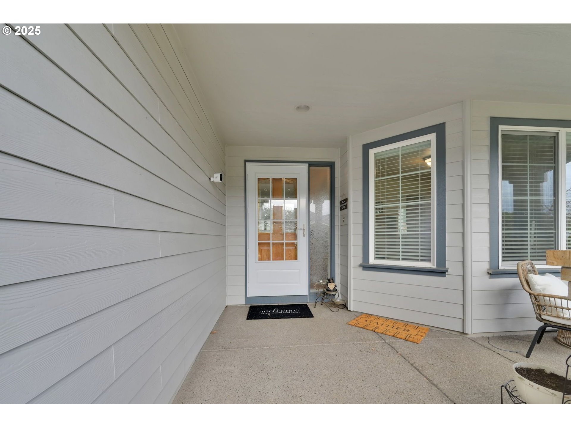 832 Mint Meadow Way Springfield, OR 97477 - Photo 3 of 31 a backyard of a house with wooden floor and outdoor seating