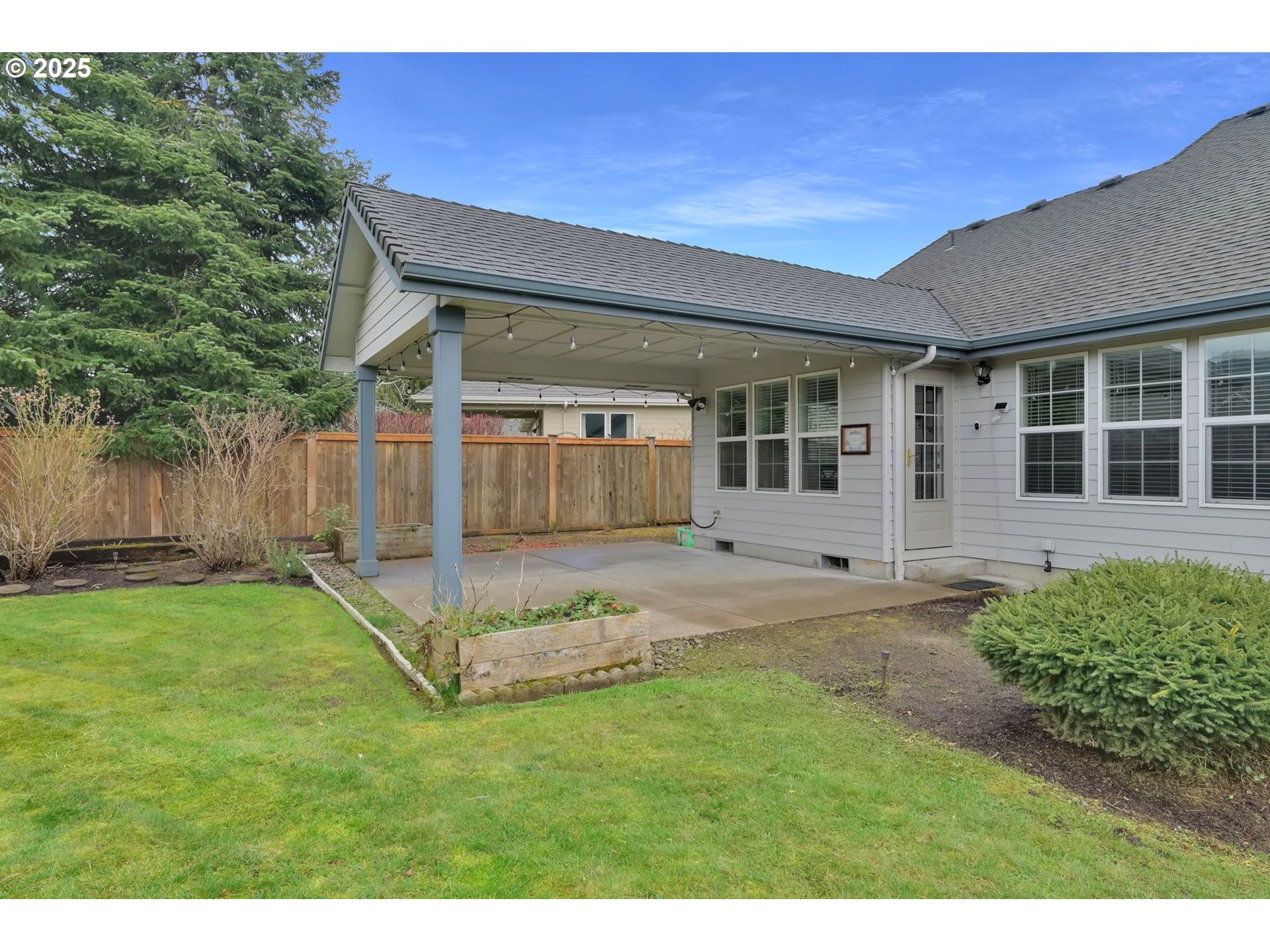 832 Mint Meadow Way Springfield, OR 97477 - Photo 31 of 31 a view of a backyard with a garden and entertaining space