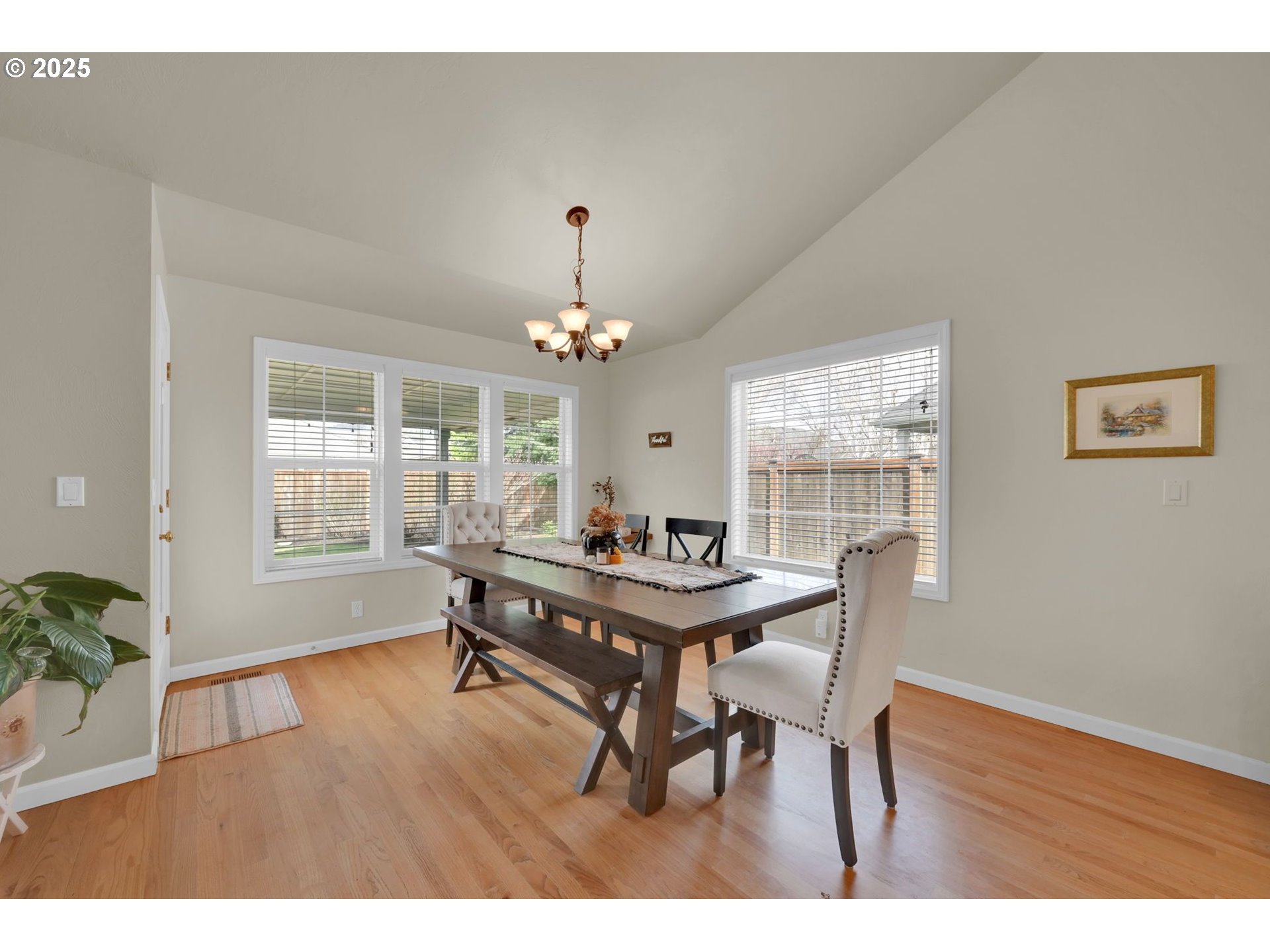 832 Mint Meadow Way Springfield, OR 97477 - Photo 5 of 31 a view of a dining room with furniture window and wooden floor