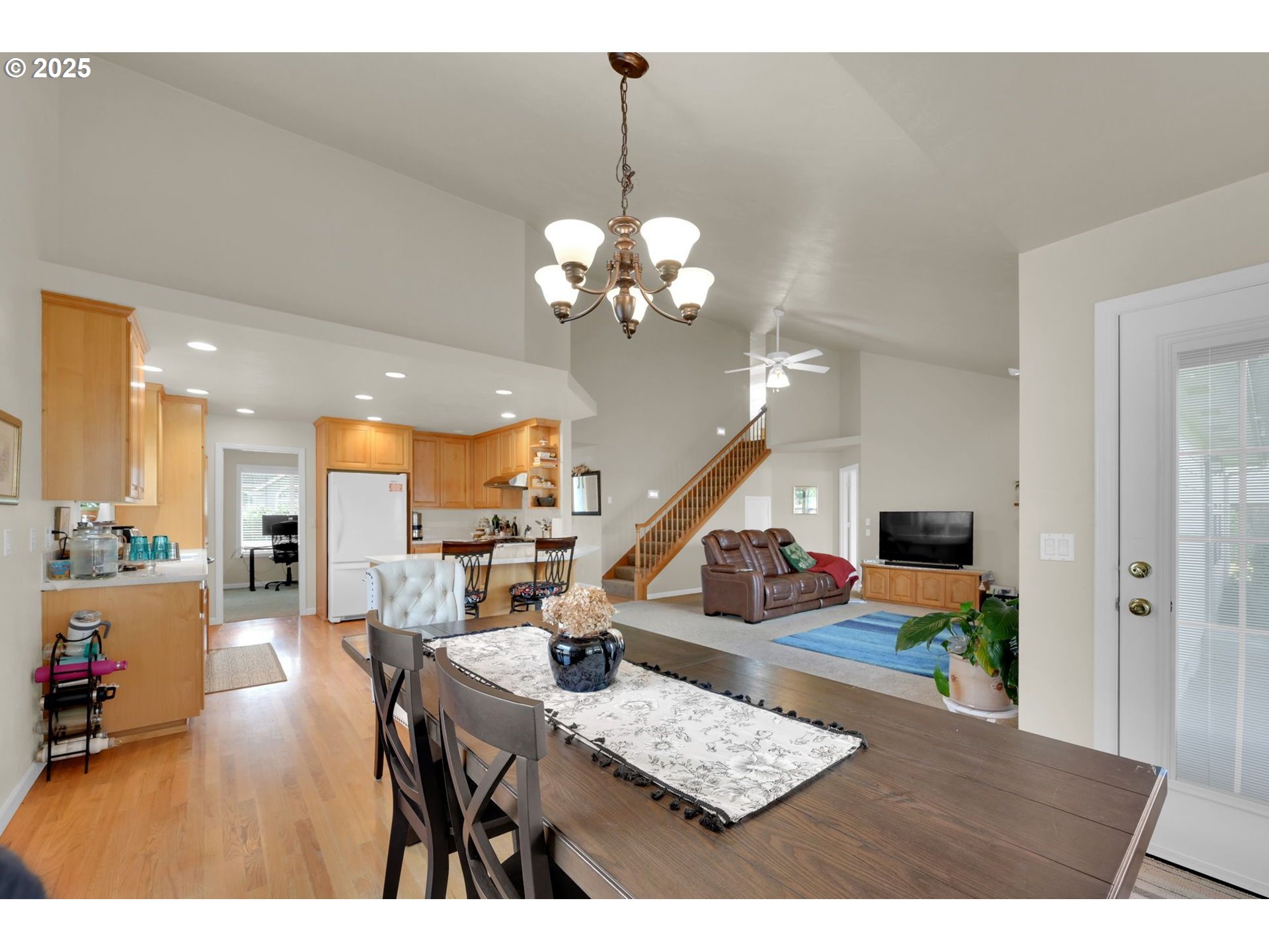 832 Mint Meadow Way Springfield, OR 97477 - Photo 10 of 31 a living room with furniture and a chandelier