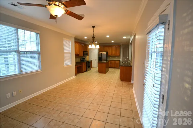 a view of a living room and kitchen with a large window
