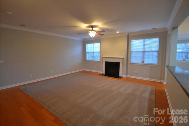 a view of empty room with a fireplace