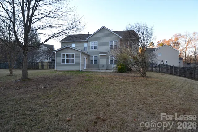 a view of large house with a yard