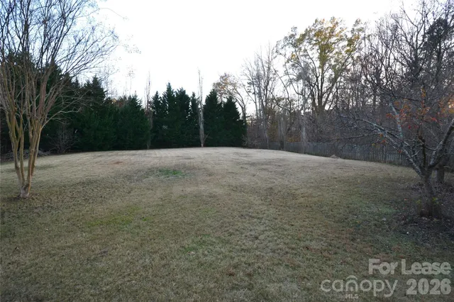 a view of empty room with trees
