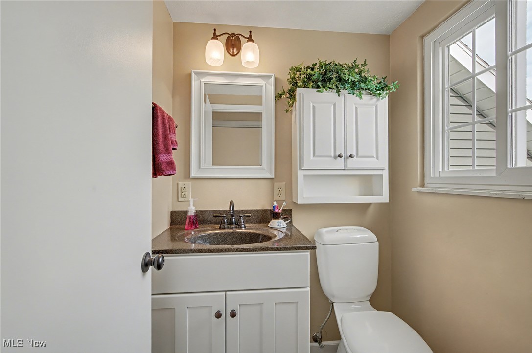 913 Rost Road Walker, WV 26180 - Photo 21 of 48 Bathroom featuring vanity and toilet