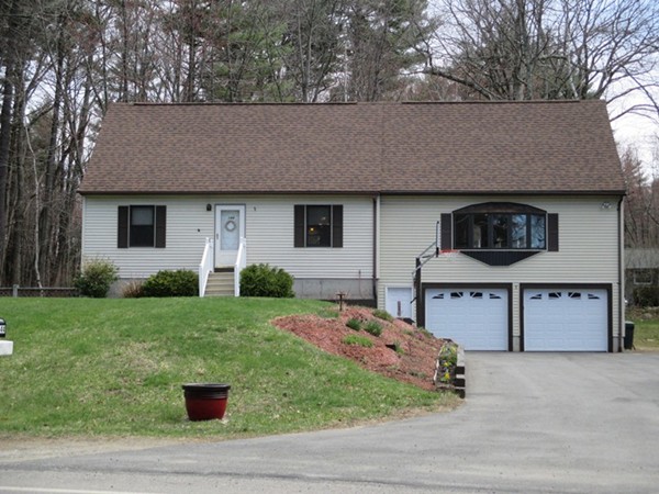 144 Shadow Lake Road Salem, NH 03079 - Photo 1 of 19 a front view of a house with garden