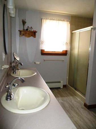 144 Shadow Lake Road Salem, NH 03079 - Photo 11 of 19 a bathroom with a sink and a mirror