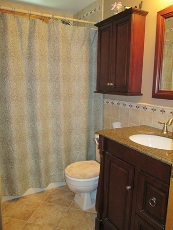 144 Shadow Lake Road Salem, NH 03079 - Photo 12 of 19 a bathroom with a granite countertop sink toilet and a mirror