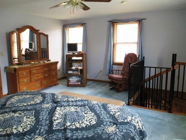 144 Shadow Lake Road Salem, NH 03079 - Photo 14 of 19 a bed room with a bed and a television
