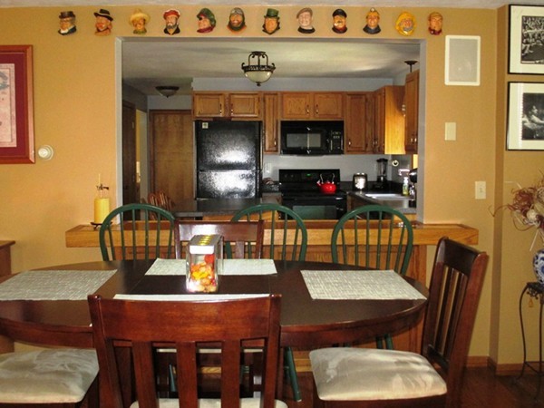 144 Shadow Lake Road Salem, NH 03079 - Photo 3 of 19 a kitchen with a dining table and chairs