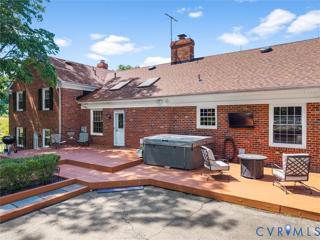 13099 Cedon Road Ashland, VA 23005 - Photo 65 of 92 Back deck has charming mature landscaping, a hot t