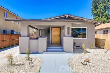 a front view of a house with a tub