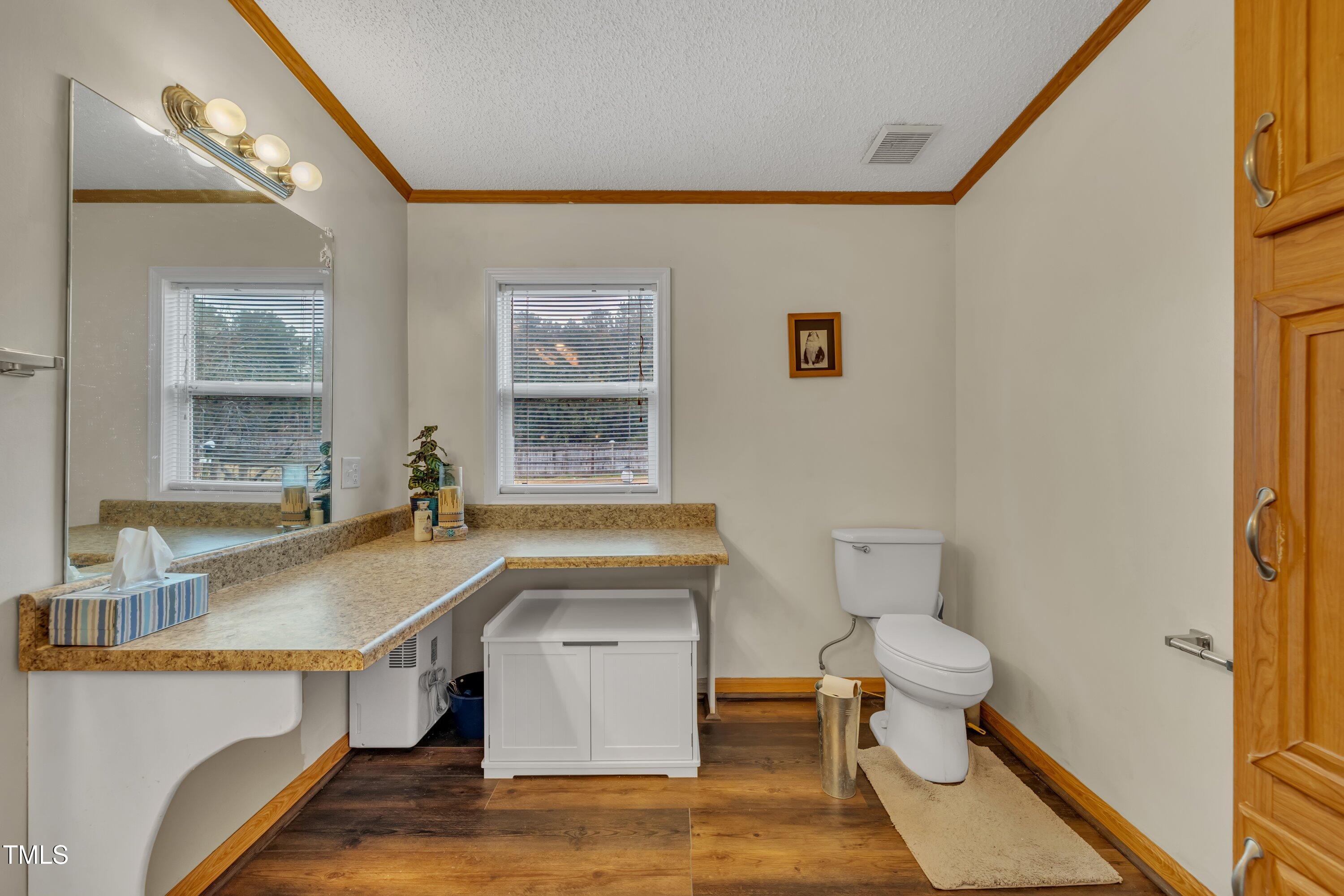 8904 Kennebec Road Willow Spring, NC 27592 - Photo 17 of 42 a room with a sink and a window
