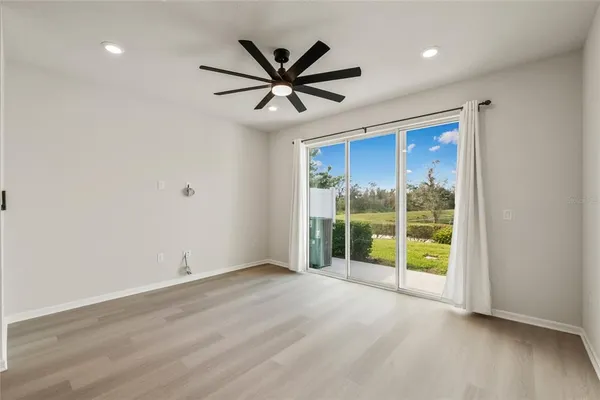 a view of an empty room with a window