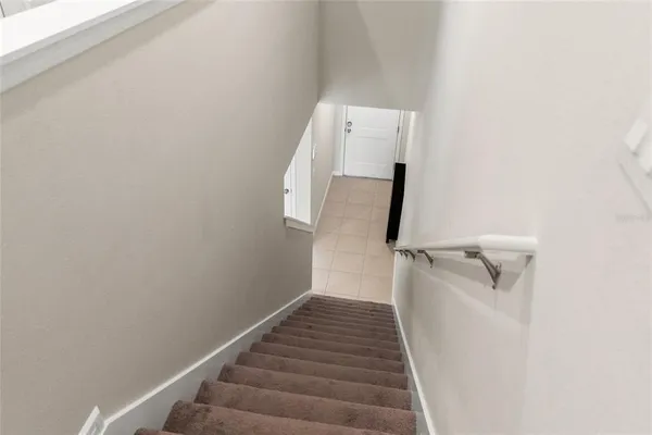 a view of a hallway with staircase