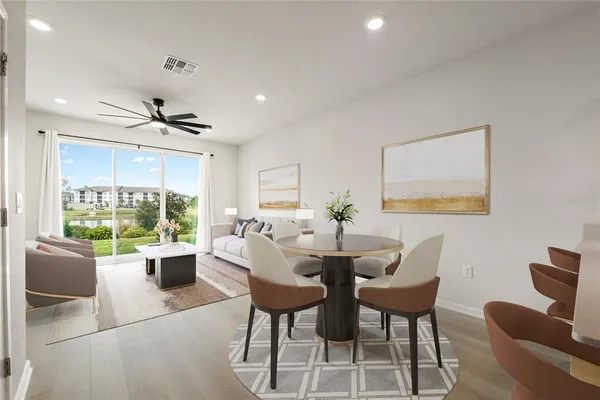 a view of a dining room with furniture window and outside view