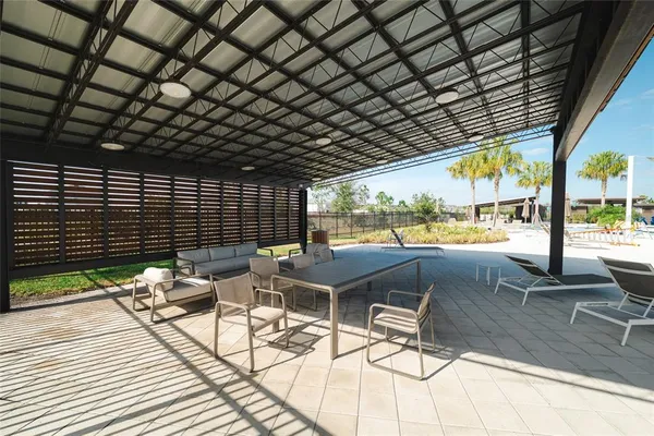 a roof deck with a table and chairs