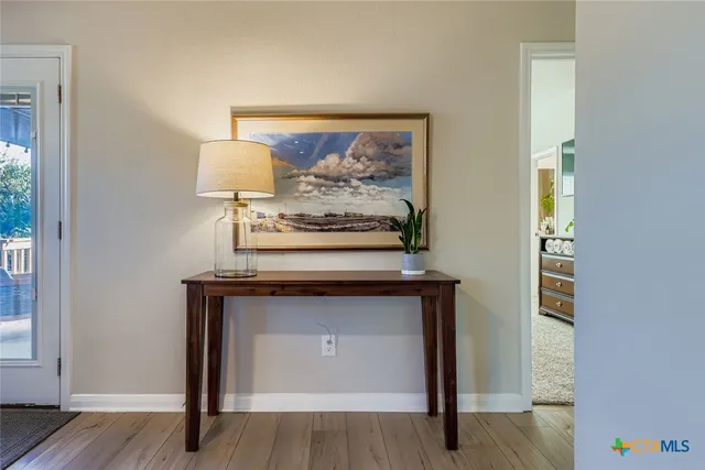 a view of fireplace with wooden floor