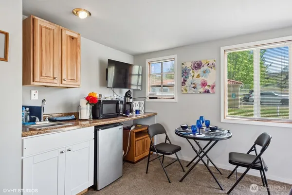 a room with furniture a flat screen tv and a large window